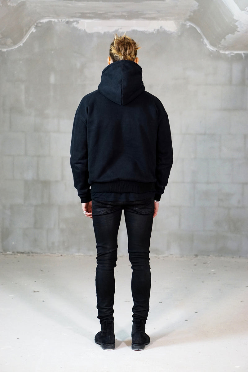 Ultra heavy black hoodie oversized with dropped shoulders silver cross at sleeve backside view