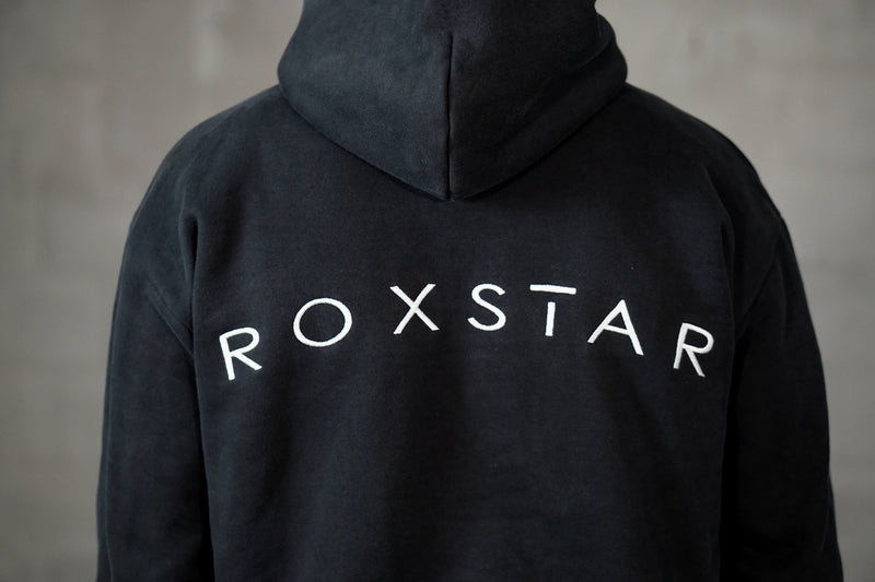 Ultra heavy black hoodie oversized with ROXSTAR embroidery with dropped shoulders silver cross at sleeve detail view
